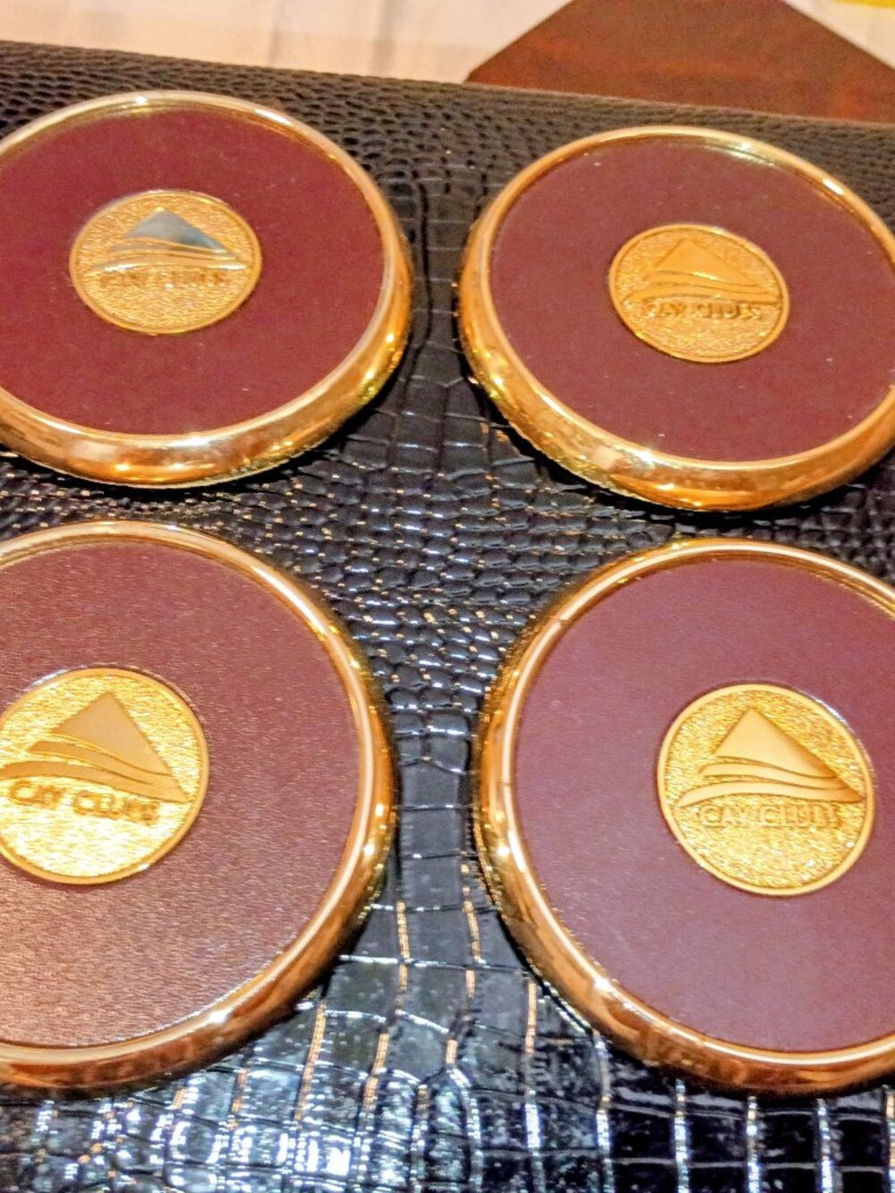 four vintage, high-end leather and brass drink coasters collectibles